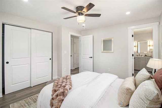 6775 Newland St, Arvada, CO 80003 - bedroom featuring wood finished floors, a closet, ensuite bath, recessed lighting, and a ceiling fan