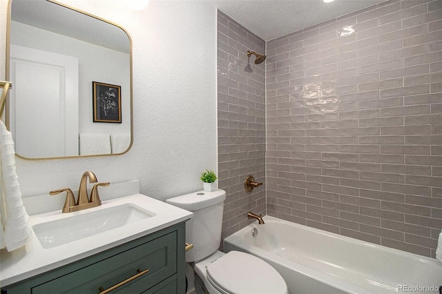6775 Newland St, Arvada, CO 80003 - full bathroom featuring toilet, vanity, and tub / shower combination