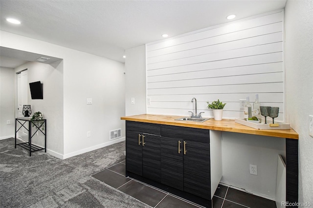 6775 Newland St, Arvada, CO 80003 - bar area featuring a sink, recessed lighting, dark carpet, and baseboards
