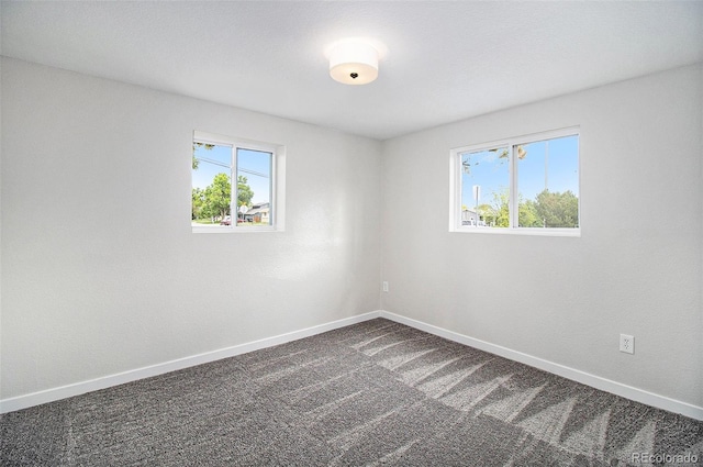 6775 Newland St, Arvada, CO 80003 - empty room with baseboards and dark carpet
