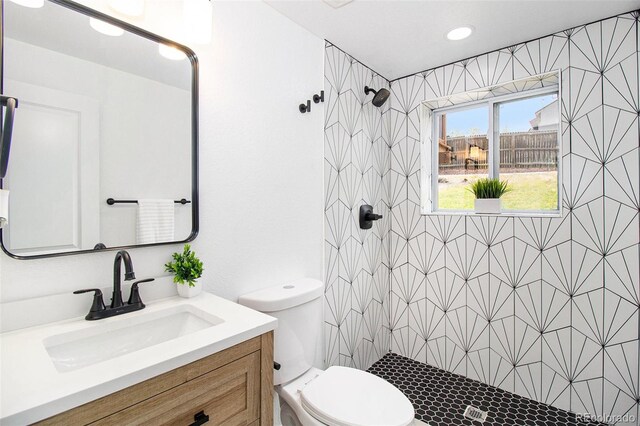 6775 Newland St, Arvada, CO 80003 - full bathroom featuring a shower stall, toilet, and vanity