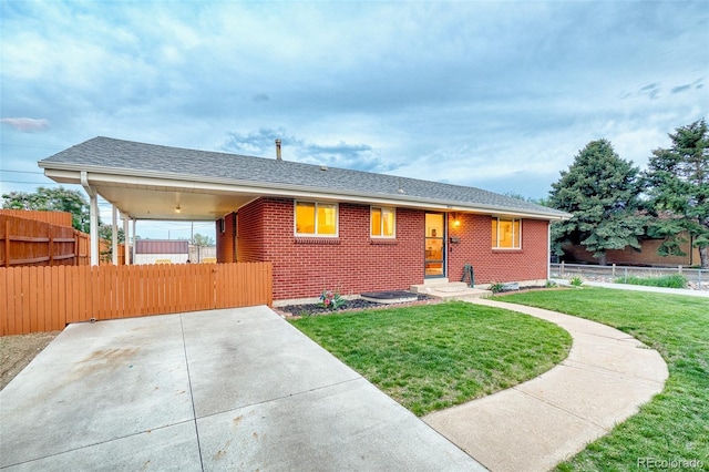 9100 Yucca Way, Thornton, CO 80229 - view of front of house with fence, brick siding, and a front yard