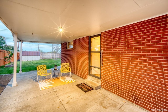 9100 Yucca Way, Thornton, CO 80229 - view of patio / terrace with a storage unit, entry steps, fence, and an outbuilding