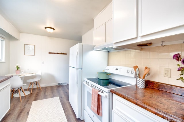 9100 Yucca Way, Thornton, CO 80229 - kitchen with white cabinetry, white electric range oven, dark wood-style floors, backsplash, and dark countertops