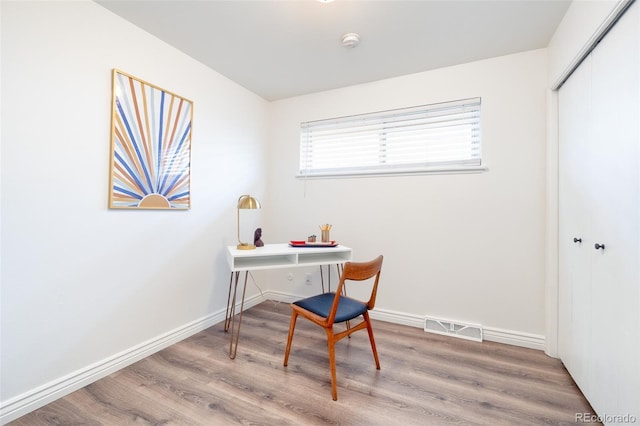 9100 Yucca Way, Thornton, CO 80229 - home office featuring baseboards, visible vents, and wood finished floors