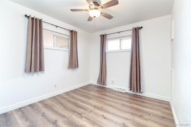 9100 Yucca Way, Thornton, CO 80229 - unfurnished room with baseboards, ceiling fan, light wood-style flooring, and visible vents