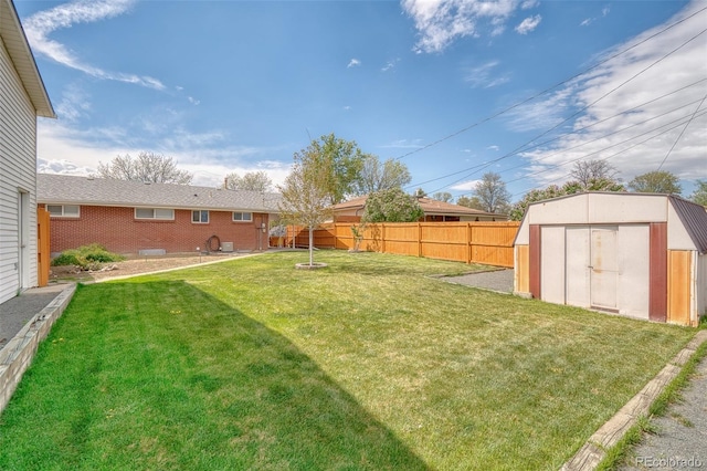 9100 Yucca Way, Thornton, CO 80229 - view of yard featuring a fenced backyard, an outbuilding, and a storage shed