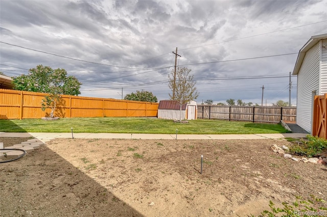 9100 Yucca Way, Thornton, CO 80229 - view of yard featuring an outbuilding, a fenced backyard, and a storage unit