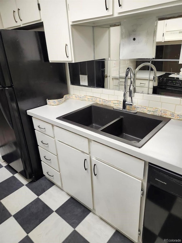 kitchen with tasteful backsplash, sink, white cabinets, and black appliances