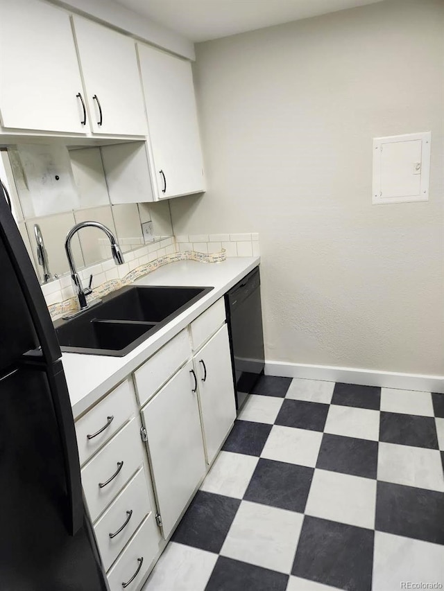 kitchen featuring white cabinets, dishwasher, and sink