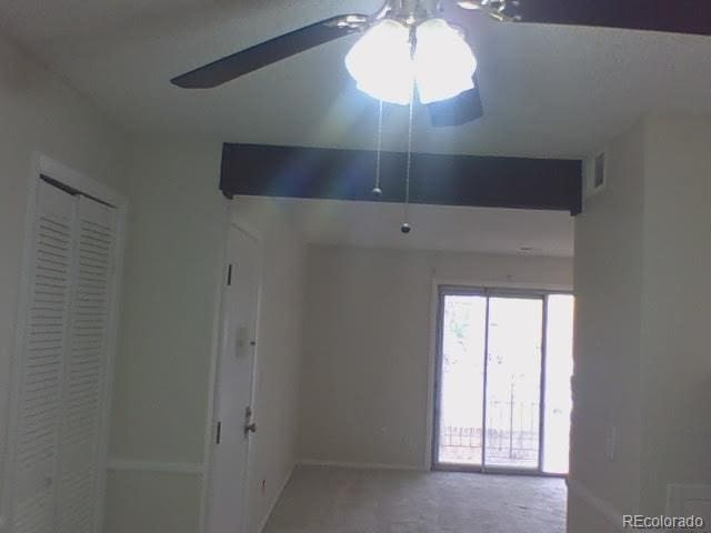 spare room with ceiling fan