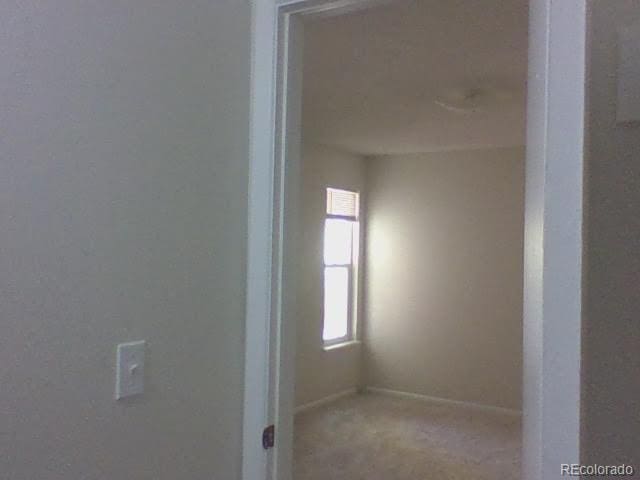 12172 Huron St Unit 207, Denver, CO 80234 - carpeted empty room featuring baseboards