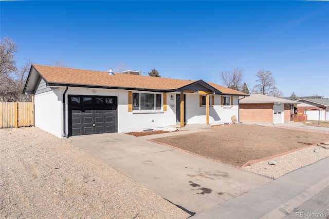 ranch-style home featuring brick siding, a shingled roof, fence, a garage, and driveway