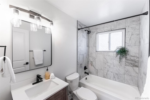 full bathroom with tub / shower combination, vanity, and toilet