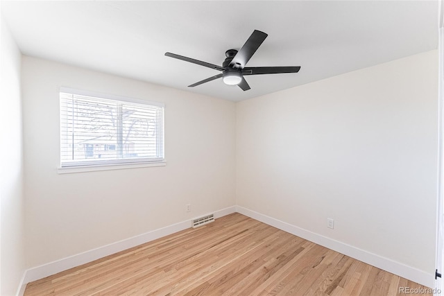 unfurnished room with a ceiling fan, baseboards, visible vents, and light wood finished floors