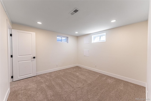 below grade area with recessed lighting, carpet, visible vents, and baseboards