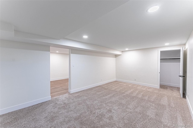 finished basement with carpet, baseboards, and recessed lighting