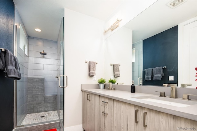 1323 Elati St Unit 3, Denver, CO 80204 - bathroom featuring a shower stall, double vanity, and recessed lighting