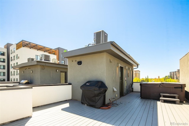 1323 Elati St Unit 3, Denver, CO 80204 - wooden deck with a hot tub and central AC unit