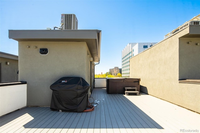 1323 Elati St Unit 3, Denver, CO 80204 - wooden deck featuring a hot tub, grilling area, and a view of city