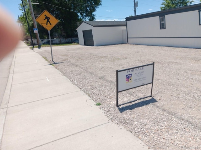 102 Jackson Dr, Firestone, CO 80520 - view of home's community with a garage