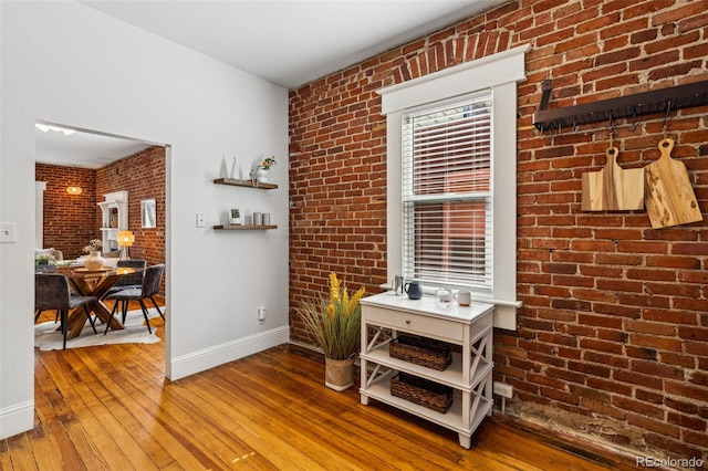 interior space featuring wood finished floors and baseboards