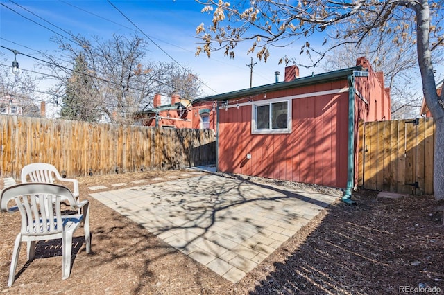 view of yard with fence and a patio