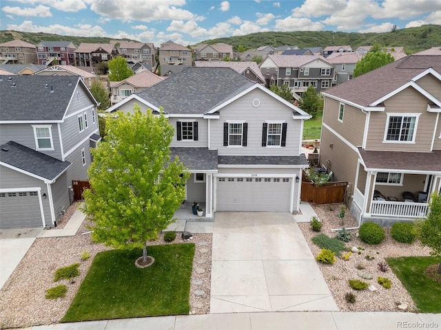 3319 Starry Night Loop, Castle Rock, CO 80109 - traditional home with a residential view, a shingled roof, driveway, and a garage