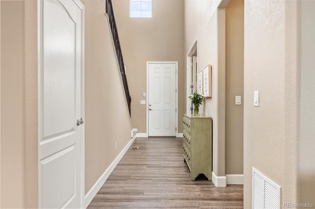 3319 Starry Night Loop, Castle Rock, CO 80109 - corridor with baseboards, wood finished floors, and a high ceiling