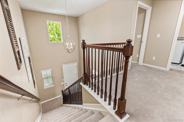 3319 Starry Night Loop, Castle Rock, CO 80109 - stairs with carpet floors, a chandelier, and baseboards