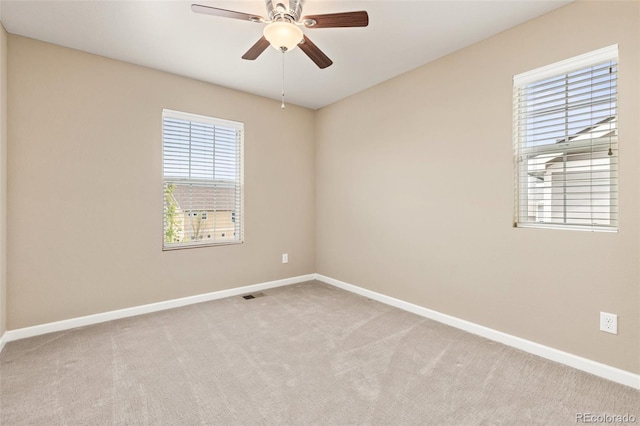 3319 Starry Night Loop, Castle Rock, CO 80109 - unfurnished room with baseboards, plenty of natural light, a ceiling fan, and light colored carpet