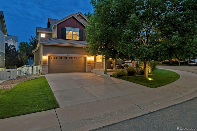 3540 Brushwood Dr, Castle Rock, CO 80109 - view of front of property with board and batten siding, driveway, and an attached garage