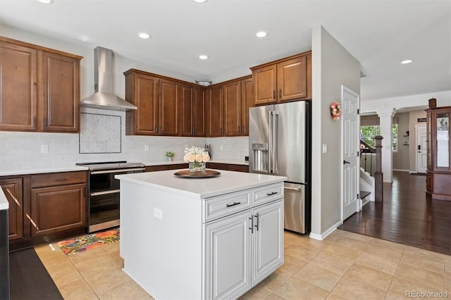 3540 Brushwood Dr, Castle Rock, CO 80109 - kitchen with stainless steel appliances, wall chimney exhaust hood, light countertops, decorative backsplash, and recessed lighting