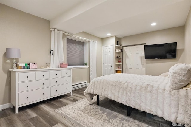 3540 Brushwood Dr, Castle Rock, CO 80109 - bedroom with a baseboard radiator, wood finished floors, and recessed lighting