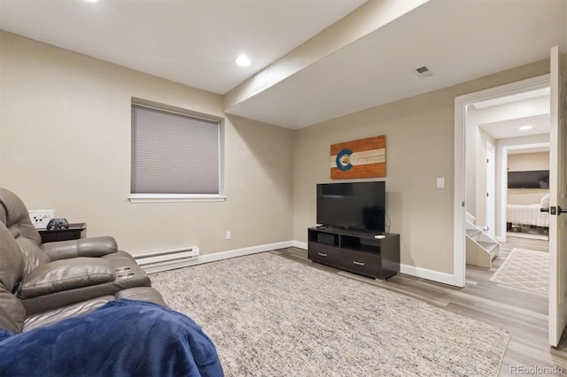 3540 Brushwood Dr, Castle Rock, CO 80109 - living area featuring wood finished floors, a baseboard radiator, and recessed lighting