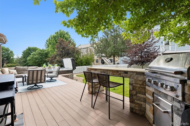 3540 Brushwood Dr, Castle Rock, CO 80109 - deck with an outdoor hangout area, a fenced backyard, and area for grilling