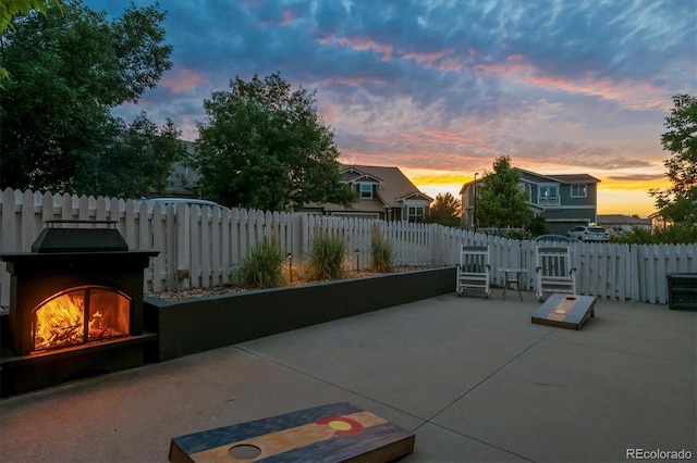 3540 Brushwood Dr, Castle Rock, CO 80109 - view of patio / terrace featuring a gate and a lit fireplace