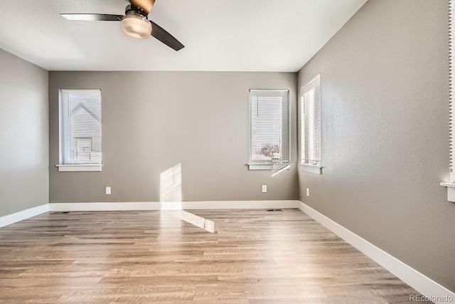 unfurnished room featuring ceiling fan and light hardwood / wood-style flooring