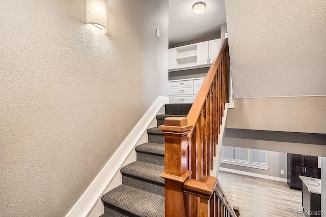 stairway with wood-type flooring