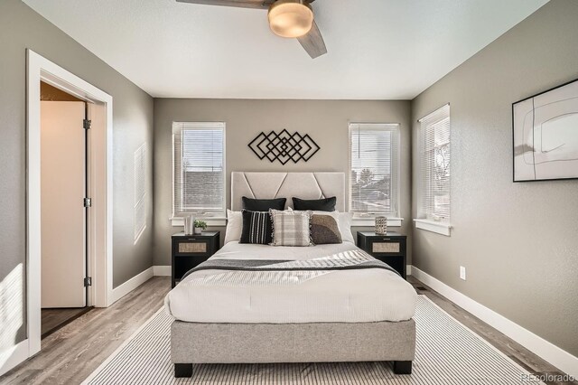 bedroom featuring ceiling fan and light hardwood / wood-style floors