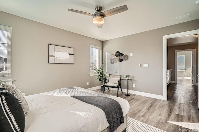 bedroom featuring ceiling fan and hardwood / wood-style flooring