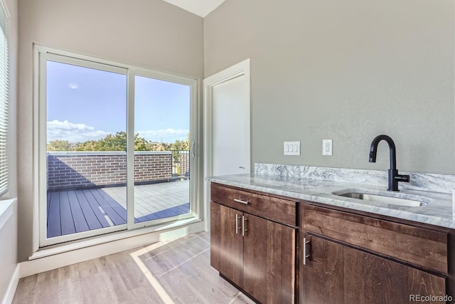 bathroom featuring sink and hardwood / wood-style floors