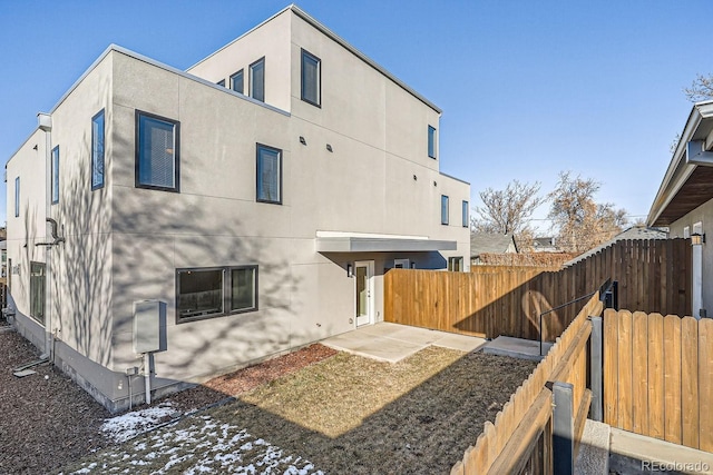 back of property featuring a patio area