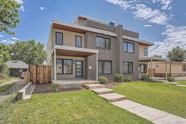 contemporary house with a front yard