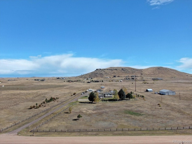 mountain view featuring a rural view