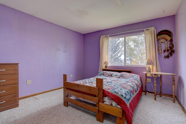 bedroom featuring light colored carpet