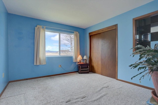 carpeted bedroom with a closet