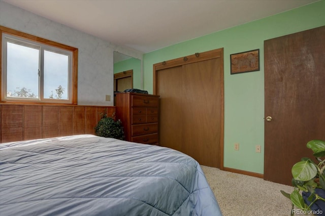 carpeted bedroom with a closet