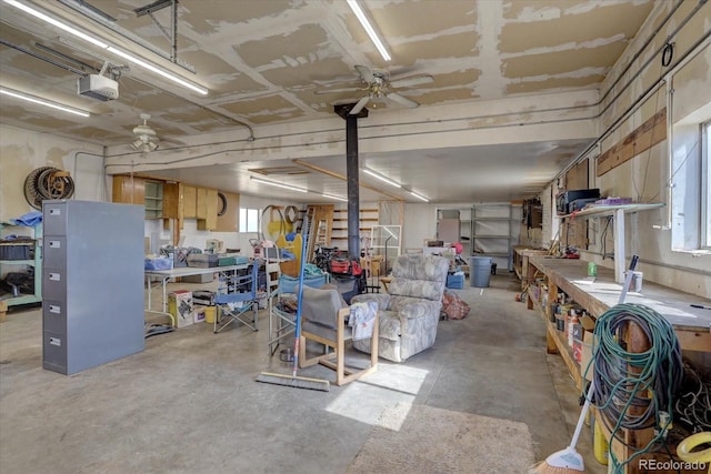 basement with a workshop area and ceiling fan