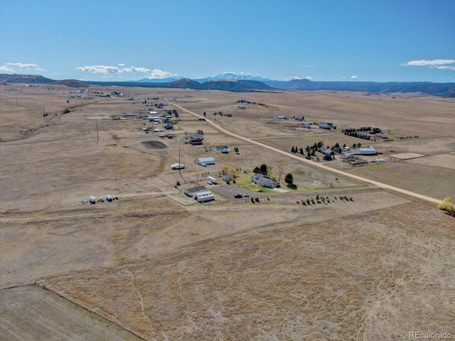 bird's eye view featuring a mountain view and a rural view